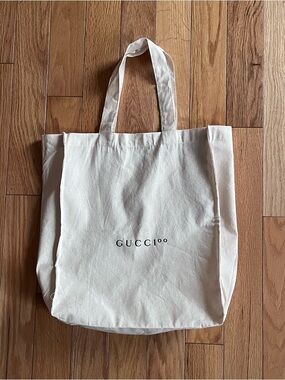 Dust Bag with GUCCI00 printed on the front.